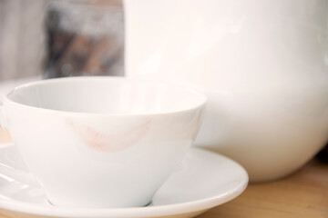 Obraz na płótnie Canvas Lipstick marks mark on a tea cup