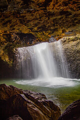 Fototapeta na wymiar Waterfall between rocks