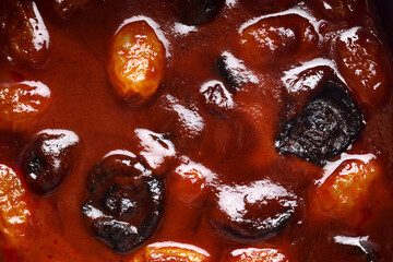 close up of homemade plant-based massaman curry with grape and prune, healthy gourmet food recipe, good work from home lunch idea