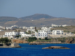 Fototapeta na wymiar Panoramic view of traditional Greek white buildings on Paros island in Aegean Sea in Greece. Paros is one of famous Greek travel destinations for tourism and vacation.