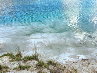 crystal clear water of abandoned limestone quarry lake