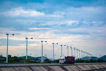 Fototapeta na wymiar wind turbine against blue sky