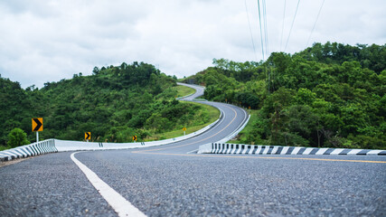 Curved and winding asphalt road in high mountains