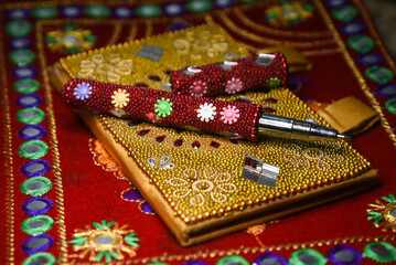 Indian handicraft decorated diary with pen Rajasthan handicraft Jaipur India. Book adorned with the...