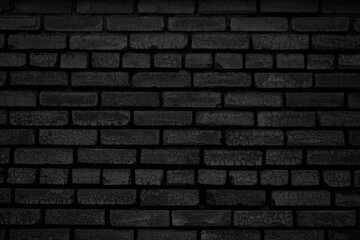 Black brick wall texture background. Black grunge background. Old brick wall with cracks.