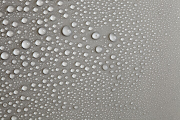 Water drops on light background, top view, close-up, macro. Great background with natural water drops and natural light