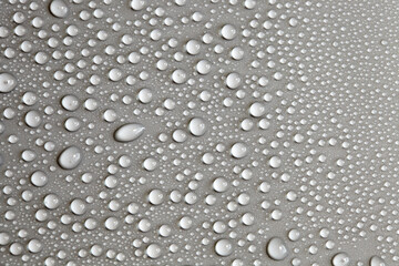 Large number of water drops. Abstract background texture. Waterfalls on a solid background, collecting bubbles on a clean surface. Raindrops, a series of natural photographs
