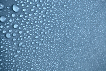 Details of water droplets, moisture condensation, hot water vapor condensation on a neutral background close-up