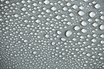 Large number of water drops. Abstract background texture. Waterfalls on a solid background, collecting bubbles on a clean surface. Raindrops, a series of natural photographs