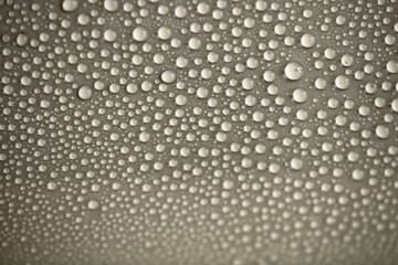 Water drops on light background, top view, close-up, macro. Great background with natural water drops and natural light