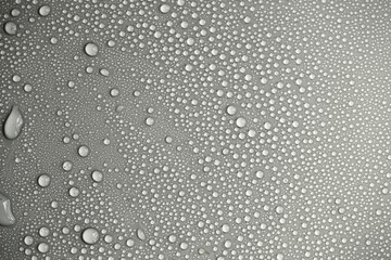 Details of water droplets, moisture condensation, hot water vapor condensation on a neutral background close-up