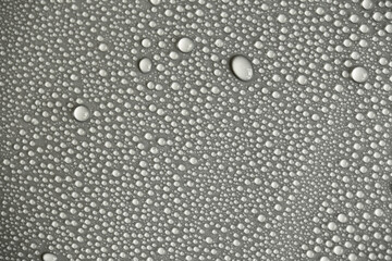 Water drops on light background, top view, close-up, macro. Great background with natural water drops and natural light