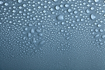 Water drops on light background, top view, close-up, macro. Great background with natural water drops and natural light