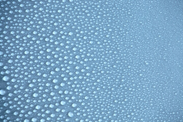 Water drops on light background, top view, close-up, macro. Great background with natural water drops and natural light