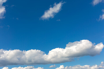 Gray clouds on blue sky background.