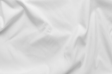Abstract white fabric texture background. Cloth soft wave. Creases of satin, silk, and cotton.	