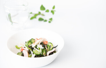 Vinegared dish with crab kanikama, cucumber and seaweed. Japanese food