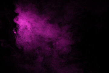 Colorful smoke close-up on a black background. Blurred pink cloud of smoke.