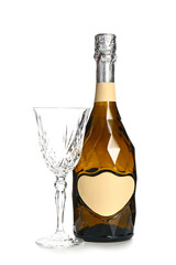 Bottle of champagne and glass on white background