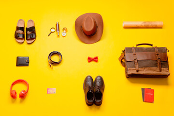 Set of travel accessories on color background
