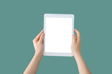 Hands with modern tablet computer on color background