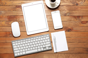 Composition with modern tablet computer on wooden background