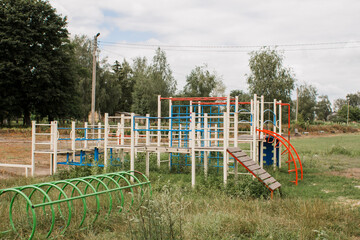 children's playground in park on a green meadow