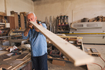 Carpenter holding a board