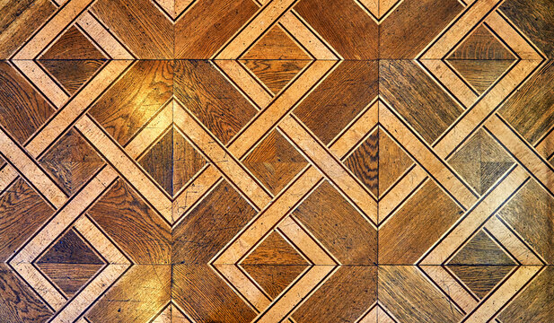 Beautiful old wooden parquet with diamond pattern as a background.