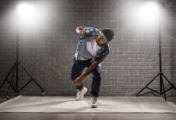 Male hip-hop dancer in studio