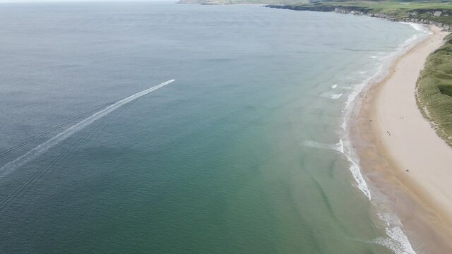 Adventure speed boat at Portrush Whiterocks beach aerial
