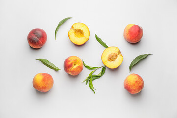 Many ripe peaches on light background