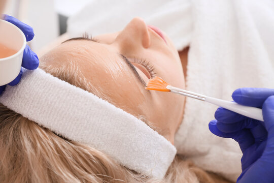 Woman undergoing procedure of carboxytherapy in beauty salon