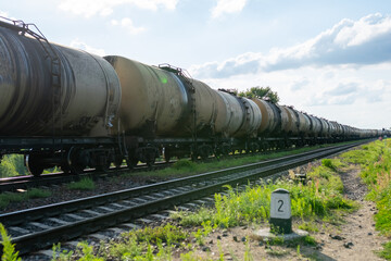 Naklejka premium Old barrels of oil on the railway.