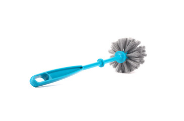 Plastic blue toilet brush with a handle to the camera.