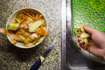 cleaning the vegetables for the soup. collection of self-degradable waste. zero waste concept. eco...