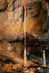 Long thin limestone stalactite and opposite stalagmite in Punkva Caves, Moravian Karst, Czech Republic