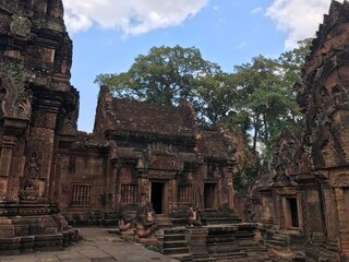 Historic Site in Cambodia, Citadel of the women, the pink color of the limestone and the elaborate decorative carvings of many female deities that grace its walls.  