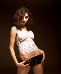 brunette woman dance on black background