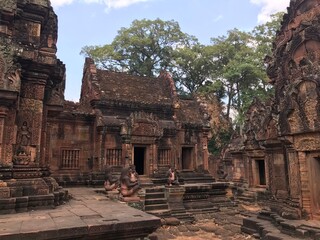 Historic Site in Cambodia, Citadel of the women, the pink color of the limestone and the elaborate decorative carvings of many female deities that grace its walls.  