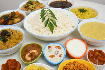 Kerala Onam sadhya, boiled rice with many curries Parippu, Sambar, dessert Payasam . traditional vegetarian feast on Onam, Vishu festival South India. Top view spicy Indian veg food