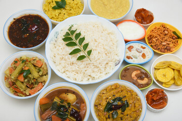 Kerala Onam sadhya, boiled rice with many curries Parippu, Sambar, dessert Payasam . traditional vegetarian feast on Onam, Vishu festival South India. Top view spicy Indian veg food