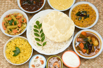 Kerala Onam sadhya, boiled rice with many curries Parippu, Sambar, dessert Payasam . traditional vegetarian feast on Onam, Vishu festival South India. Top view spicy Indian veg food