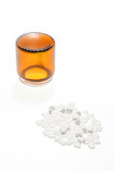 A bottle and a bunch of love pills isolated on the white
