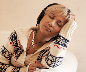 music - young blond woman with headphones