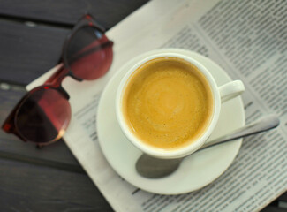 Morning coffee and a fresh newspaper.