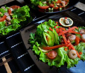 delicious salad over black plate