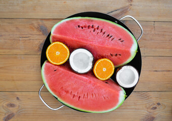orange coconut watermelon in a plate