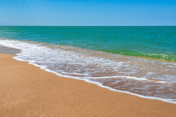 Fototapeta na wymiar Beach with turquoise sea and yellow sand, resort summer background