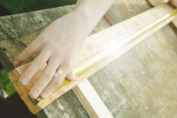 Hands with tape measure. Image for content